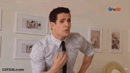 Man In White Shirt And Black Tie Says Vos Sos Tarada GIF