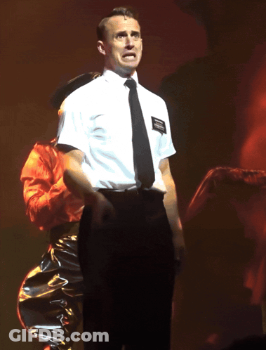 Man In White Shirt And Black Tie With Joseph Smith Patch GIF