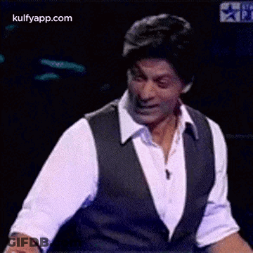 Man In White Shirt And Black Vest Dancing GIF