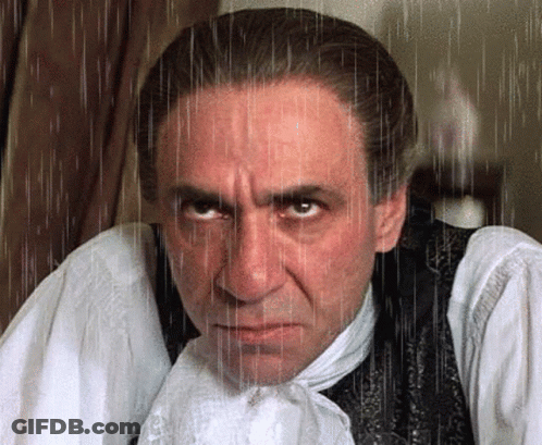 Man In White Shirt And Black Vest With Rain Drops GIF