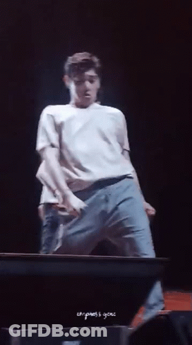 Man In White Shirt And Blue Jeans On Stage GIF