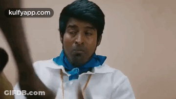 Man In White Shirt And Blue Scarf Looking GIF