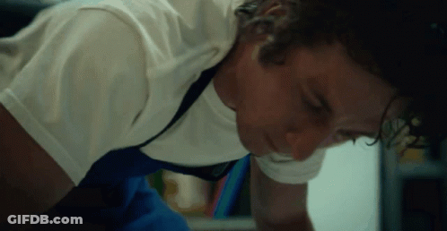 Man In White Shirt And Blue Shorts Lying GIF