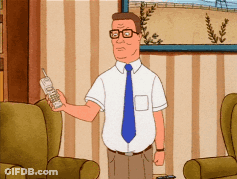 Man In White Shirt And Blue Tie Holding Cellphone GIF