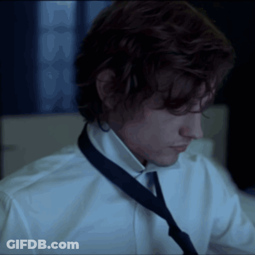 Man In White Shirt And Blue Tie Looking Down GIF