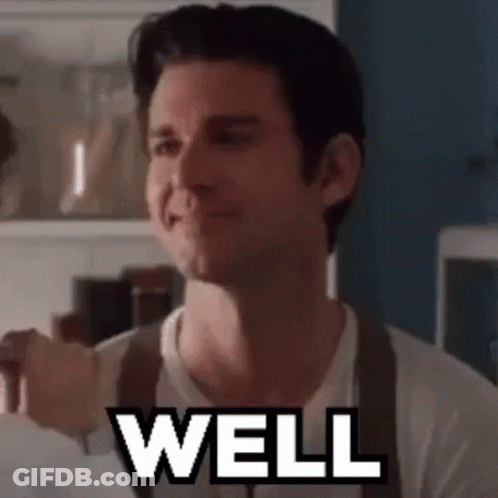 Man In White Shirt And Brown Suspenders Saying Well GIF