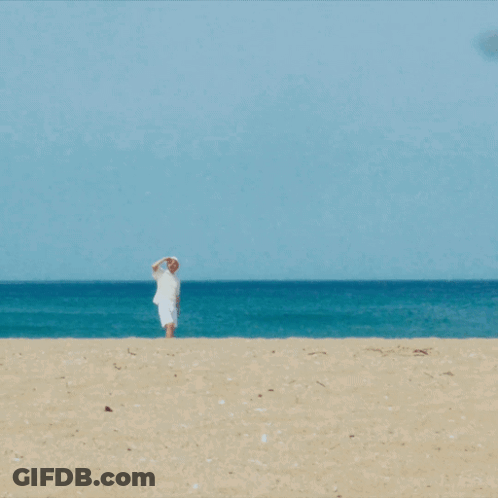 Man In White Shirt And Hat On Beach GIF