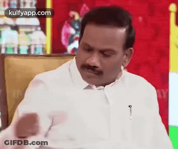 Man In White Shirt And Mustache Making Funny Face GIF