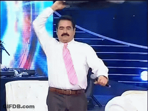 Man In White Shirt And Pink Tie Holding Microphone GIF