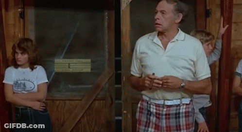 Man In White Shirt And Plaid Shorts GIF
