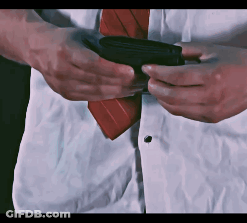Man In White Shirt And Red Tie Holding Black Wallet GIF