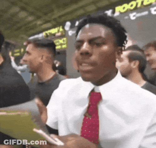 Man In White Shirt And Red Tie In Crowd GIF