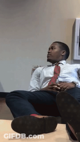 Man In White Shirt And Red Tie On Couch GIF