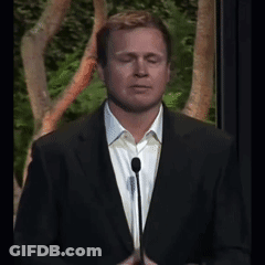 Man In White Shirt And Suit Eyes Closed At Microphone GIF