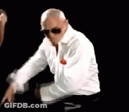 Man In White Shirt And Sunglasses Kneeling GIF