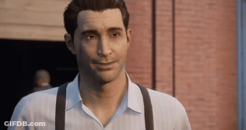 Man In White Shirt And Suspenders Smiling In Front Of Brick Wall GIF