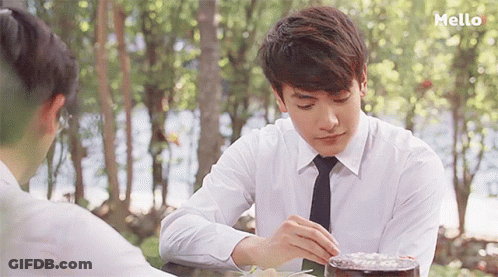 Man In White Shirt And Tie At Table GIF