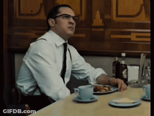 Man In White Shirt And Tie At Table With Plate Of Food GIF