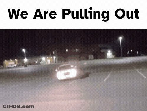 Man In White Shirt And Tie Dancing In Front Of NBC Sign GIF