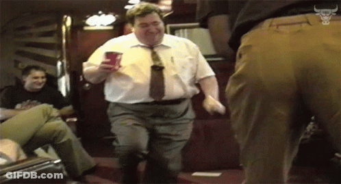 Man In White Shirt And Tie Dancing With Red Cup GIF