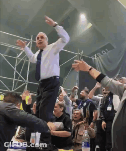 Man In White Shirt And Tie Dancing With Tob Sign GIF