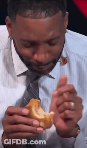 Man In White Shirt And Tie Eating Sandwich GIF