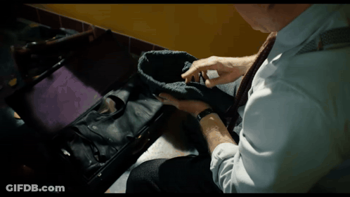 Man In White Shirt And Tie Holding Black Hat GIF