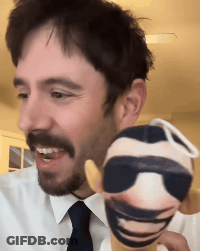 Man In White Shirt And Tie Holding Sunglasses Doll GIF