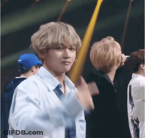 Man In White Shirt And Tie In Crowd GIF
