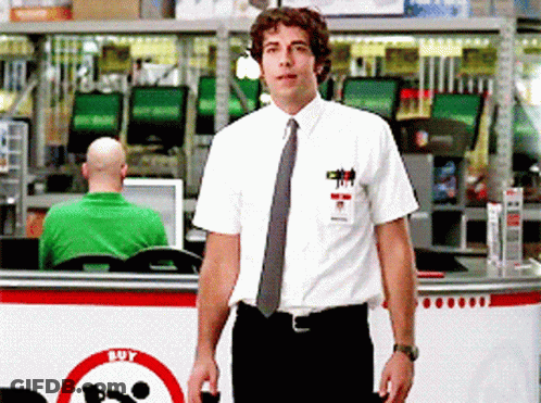 Man In White Shirt And Tie In Front Of Buy Sign GIF