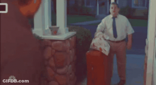 Man In White Shirt And Tie In Front Of NBC Mailbox GIF
