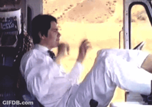 Man In White Shirt And Tie Legs Crossed In Car GIF