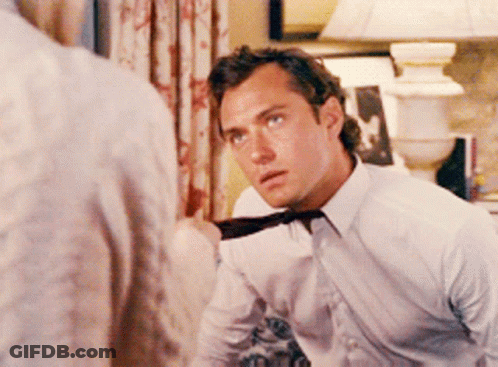 Man In White Shirt And Tie Looking GIF
