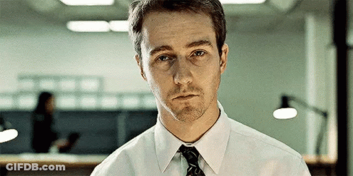 Man In White Shirt And Tie Looking At Camera GIF