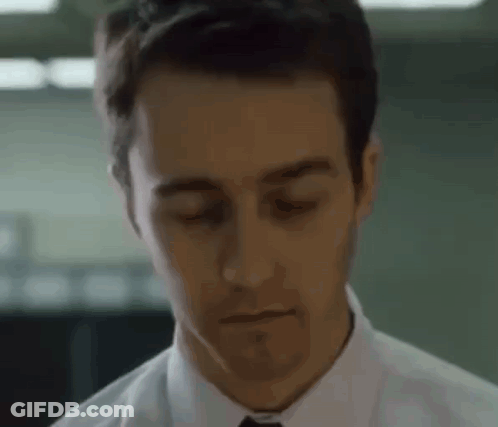 Man In White Shirt And Tie Looking Down GIF