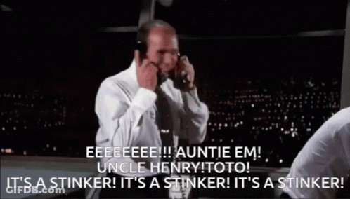 Man In White Shirt And Tie On Phone Saying It's A Stinker GIF