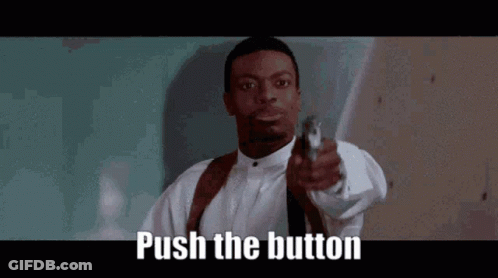 Man In White Shirt And Tie Pointing Gun GIF