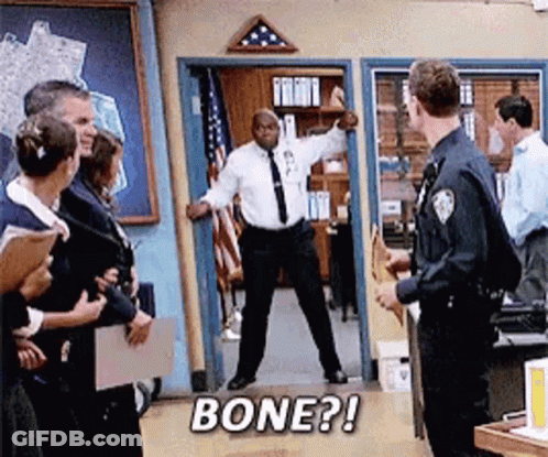 Man In White Shirt And Tie Saying Bone In Doorway GIF