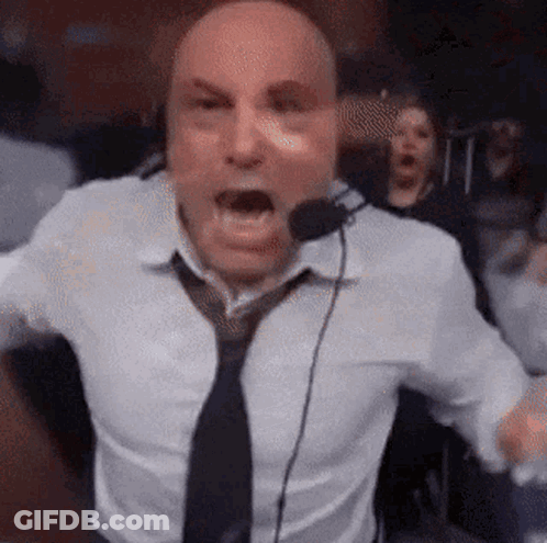 Man In White Shirt And Tie Screaming Into Microphone GIF