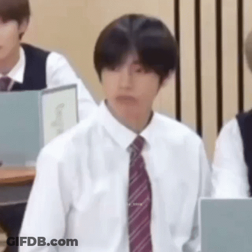 Man In White Shirt And Tie Sitting In Classroom GIF