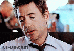 Man In White Shirt And Tie Smoking Cigarette GIF