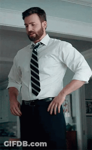 Man In White Shirt And Tie Standing In Doorway GIF