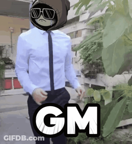 Man In White Shirt And Tie Standing In Front Of Tree Saying GM GIF