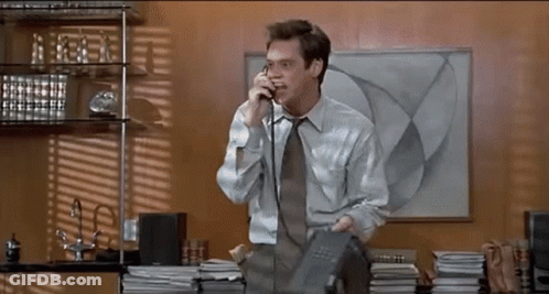 Man In White Shirt And Tie Talking On Phone GIF