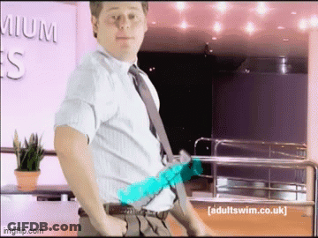 Man In White Shirt And Tie With Adultswim.co.uk Sign GIF