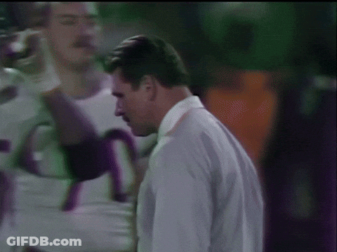 Man In White Shirt And Tie With Football Players 75 GIF