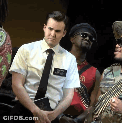 Man In White Shirt And Tie With Name Tag Elijah Price GIF