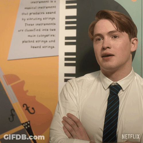 Man In White Shirt And Tie With Netflix Logo GIF
