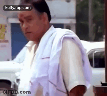 Man In White Shirt And Towel Beside White Car GIF