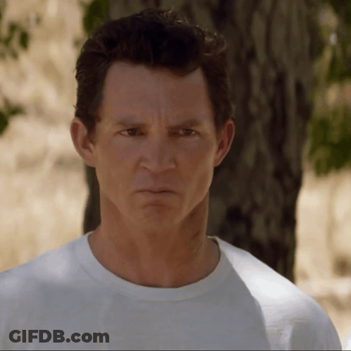 Man In White Shirt Angry At Camera GIF